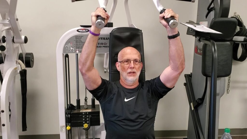 how to regain muscle mass after 60 using the shoulder press machine